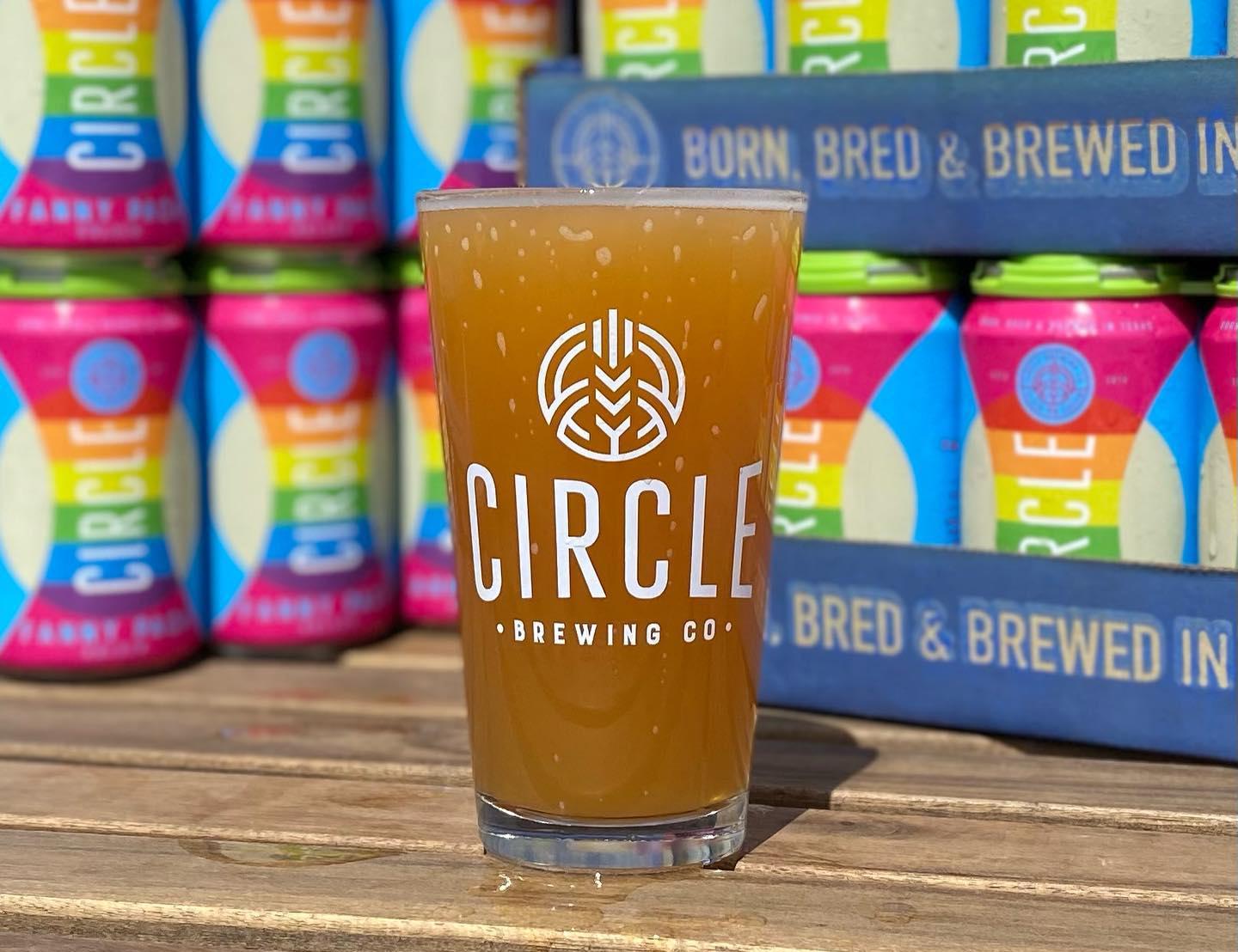 A single, meticulously poured glass of Circle Brewing Company beer, capturing the essence of craftsmanship and the rich, golden hue of the brew. A delightful representation of the brewery's dedication to quality in every sip.